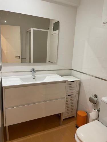 a bathroom with a sink and a toilet at Calle Juan Lirola in Almería