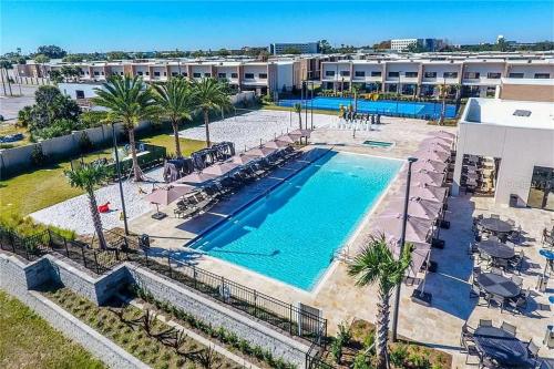 an overhead view of a swimming pool at a resort at Magic Village 4 Bedroom! Welcome Home! in Orlando