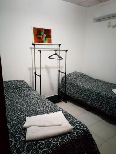 Postel nebo postele na pokoji v ubytování Departamento Donovan III