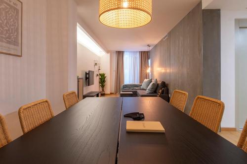a conference room with a large wooden table and chairs at Moontels Paseo de Ruzafa in Valencia