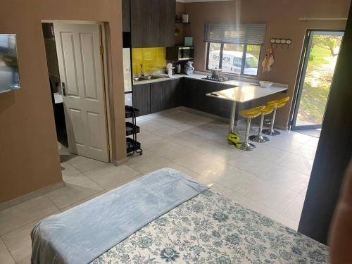 a kitchen with a table and a counter top at 7th Heaven in Tugela Mouth