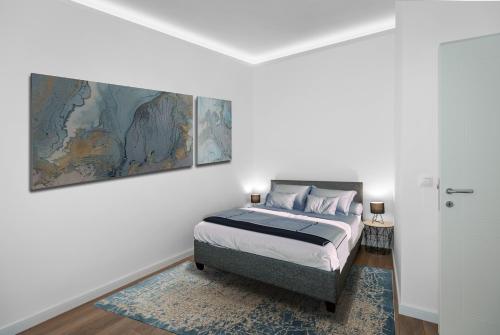 Ένα ή περισσότερα κρεβάτια σε δωμάτιο στο Viktor Luxury Suites