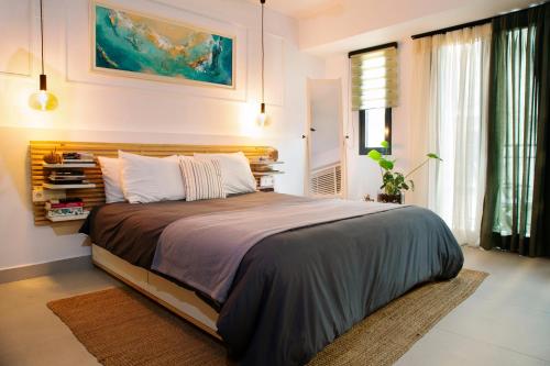 a bedroom with a large bed in a room at Soho #1 Luxurious apartment in Saint Nicolas in Agios Nikolaos