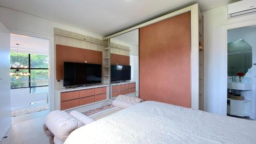 Cama o camas de una habitación en Aconchegante apartamento térreo na Praia de Mariscal