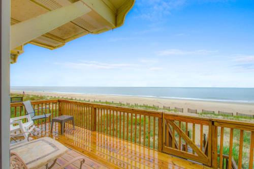 a balcony with a view of the beach at 1 Anchors Away Oceanfront in Holden Beach
