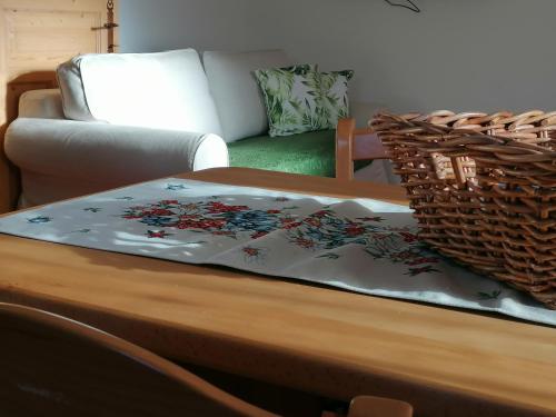a coffee table with a blanket on top of it at L'inizio... in Val di Zoldo