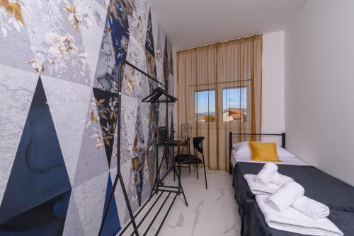 Posteľ alebo postele v izbe v ubytovaní Batinic Apartments