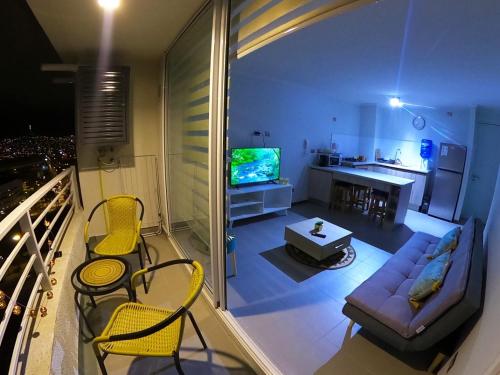 a living room with a couch and a table at Departamento Coquimbo La Serena in Coquimbo