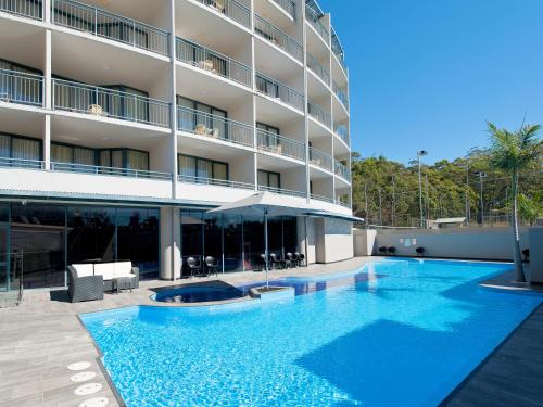 a large swimming pool in front of a building at 123 Landmark in Nelson Bay