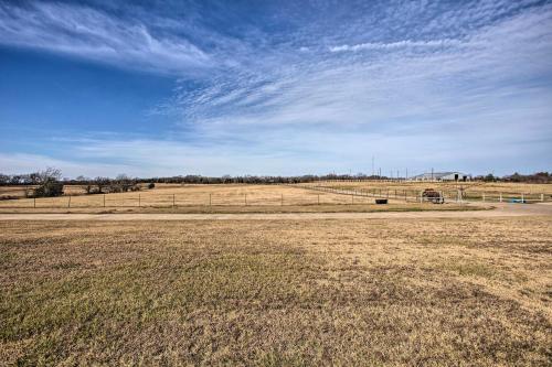 a field with a fence and a blue sky at Ranch Getaway with Pool and Horse Stall Access! in Calera