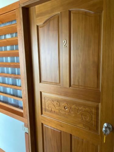 a wooden cabinet with the number on it at Ha Ke Stay in Chishang
