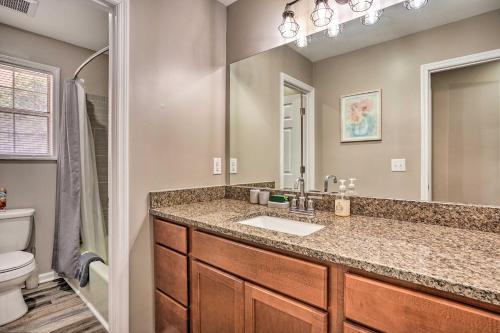 a bathroom with a sink and a toilet at Moncks Corner Home with Yard Near Lake Moultrie in Moncks Corner