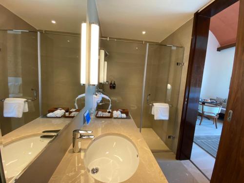 a bathroom with a toilet and a shower at Marasa Sarovar Premiere, Bodhgaya in Bodh Gaya
