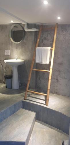 a ladder in a bathroom with a sink and a towel at Samui Beach Residence Hotel in Chaweng