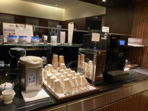 a counter in a restaurant with aasteryasteryasteryasteryasteryasteryasteryasteryastery at Nagoya Tokyu Hotel in Nagoya