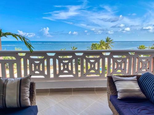 a balcony with a view of the ocean at La Mera Ocean-View, 2 Bedroom - Apartment with Pool and NEW renovated Art Style Rooms in Shanzu