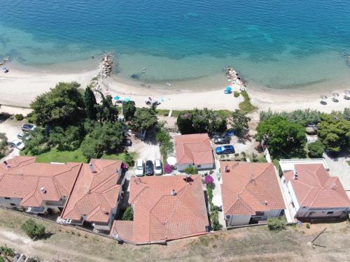 an aerial view of a house and the beach at Porto Almira Beachfront House in Nikiti