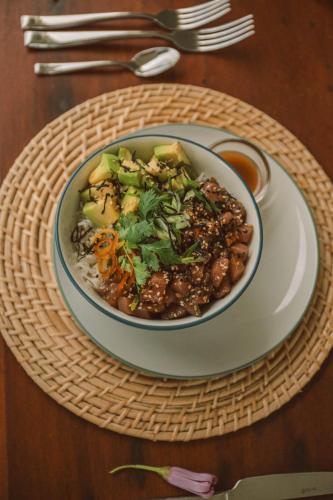 a bowl of food on a plate on a table at Naomi Beach Resort - Adults only in Weligama