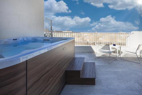 a hot tub on the roof of a building at The Barrister in Valletta