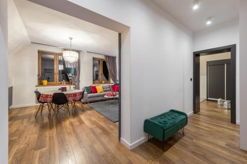 a living room with a couch and a table at WILLA JAROSTA & SPA, AC -free parking in Zakopane
