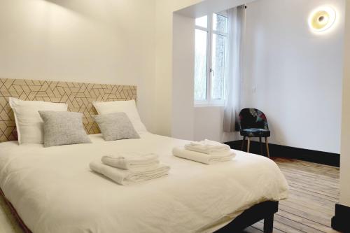 Säng eller sängar i ett rum på La Maison d'Ingénieur