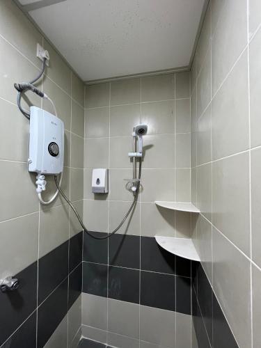 a shower stall in a bathroom with a shower at Cameron Emerald Avenue @ Brinchang in Cameron Highlands