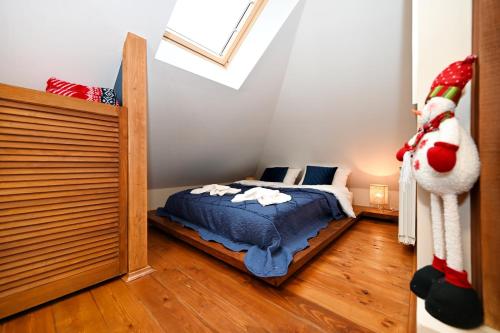 a bedroom with a bed with a santa clause at Pokoje na Jasnej in Szczyrk