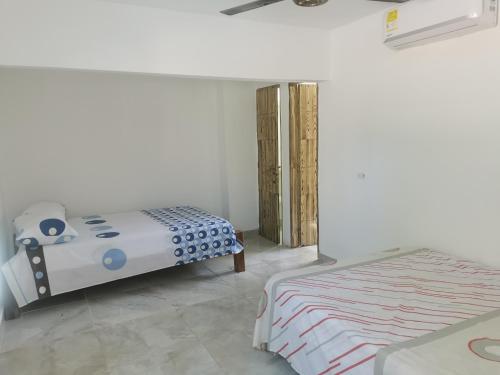 Ein Bett oder Betten in einem Zimmer der Unterkunft Cabaña Villa Roma