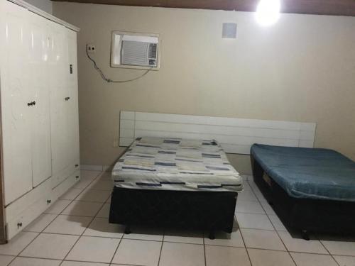 Postel nebo postele na pokoji v ubytování Arembepe