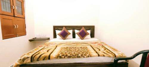 a bedroom with a bed in a room at Hotel Shannti Inn in Varanasi