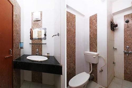 塔拉皮斯的住宿－MADHU MAMATA HOTEL，一间带卫生间和水槽的浴室