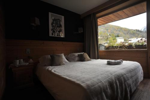 Postel nebo postele na pokoji v ubytování Hotel Le Monal