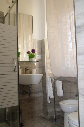 a bathroom with a sink and a toilet at My Rhome Prati in Rome