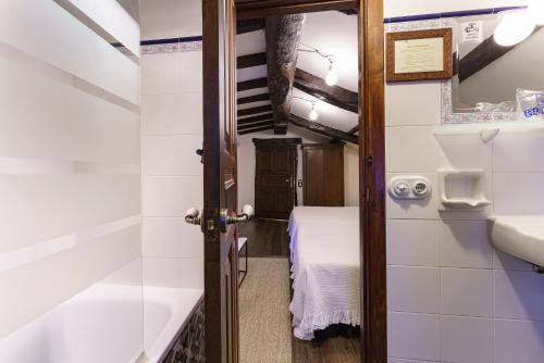a small bathroom with a sink and a toilet at Casa Brandariz in Santa Maria de Arzua