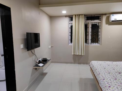 TV a/nebo společenská místnost v ubytování Guesthouse Sakina Colva