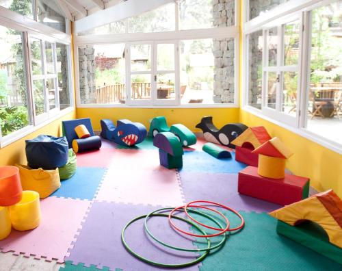 a play room with a lot of toys in it at Carilo Village Apart Hotel & Spa in Carilo