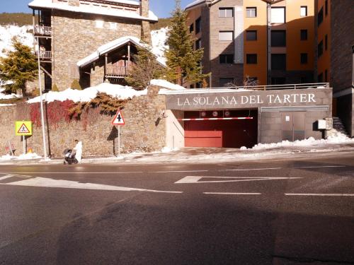 a person is sitting on the side of a street at Solana-El Tarter in El Tarter