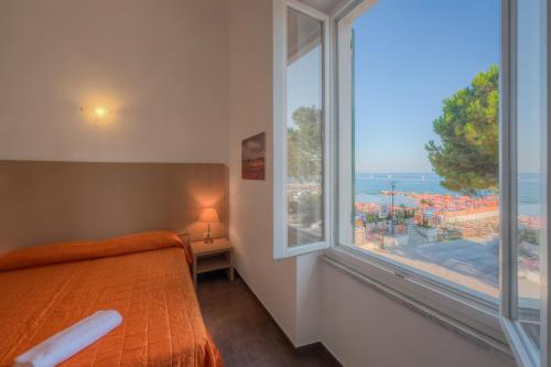 A bed or beds in a room at Affittacamere Da Flo