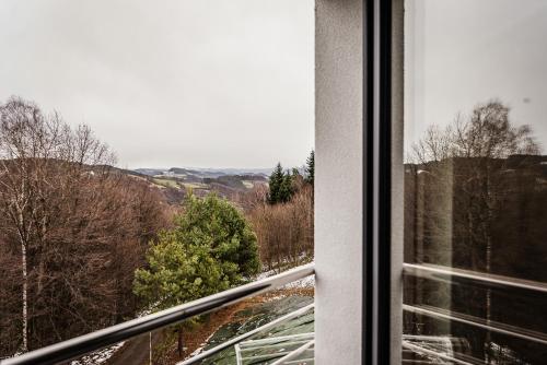 a window with a view of the countryside at KROSNA92 in Krosna