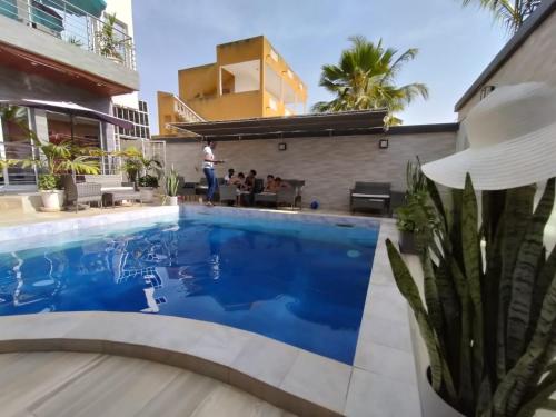 a view of a swimming pool in a building at Club saft saly niakhal niakhal in Mbour