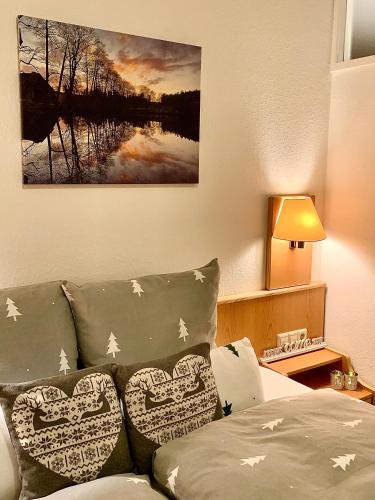a living room with a couch with pillows at FeWo Fuchs Saig in Lenzkirch