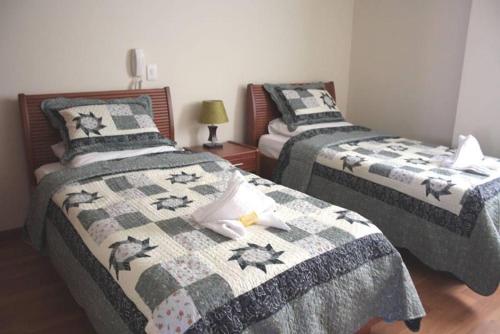 Postel nebo postele na pokoji v ubytování Hotel Castillo Real
