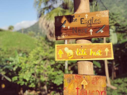 a sign that says the eagles next to the hut at The Valley Tayrona hostel- A social jungle hostel in El Zaino