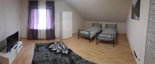 Katil atau katil-katil dalam bilik di Ferienwohnung in Erftstadt