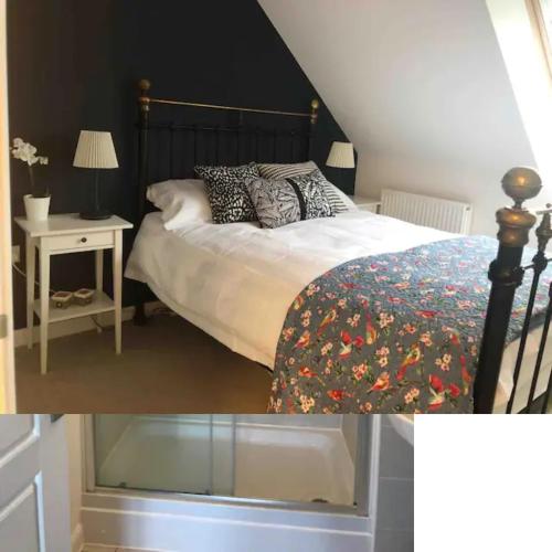 a bedroom with a bed with a glass window at 4 bedroom house in seaside town in Littlehampton
