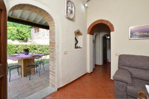 a house with a patio with a table and chairs at Il Fiorino di Badia in Badia A Passignano