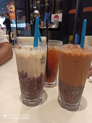 three milkshakes are sitting on a table at Bdr Bukit Tinggi Klang Tropicana Garden Homestay in Klang