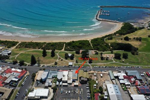 an aerial view of the beach and the ocean at Blue Ocean Motel Apollo Bay in Apollo Bay