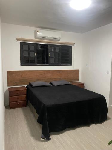Postel nebo postele na pokoji v ubytování Linda casa com jacuzzi no coração de ponta negra