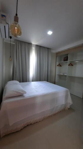 A bed or beds in a room at Casa de Praia